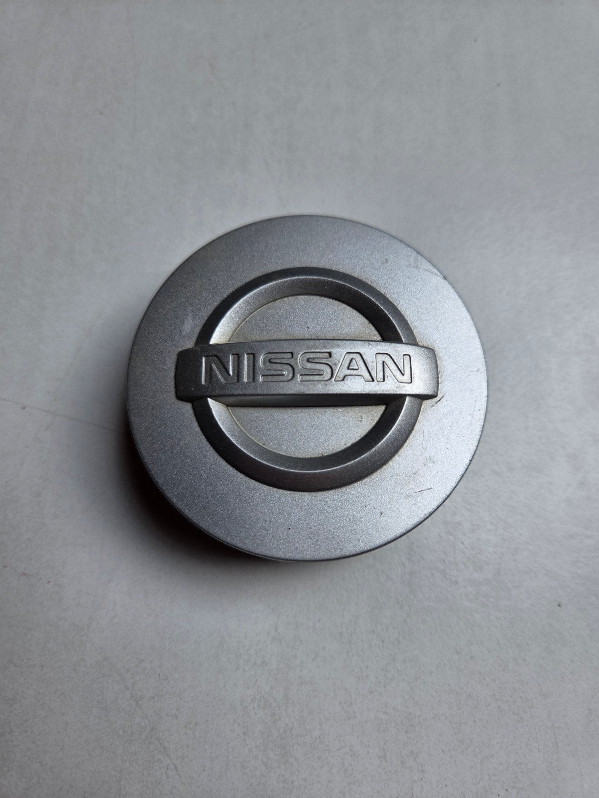 Nissan naafdop 70mm, Auto diversen, Wieldoppen, Ophalen of Verzenden