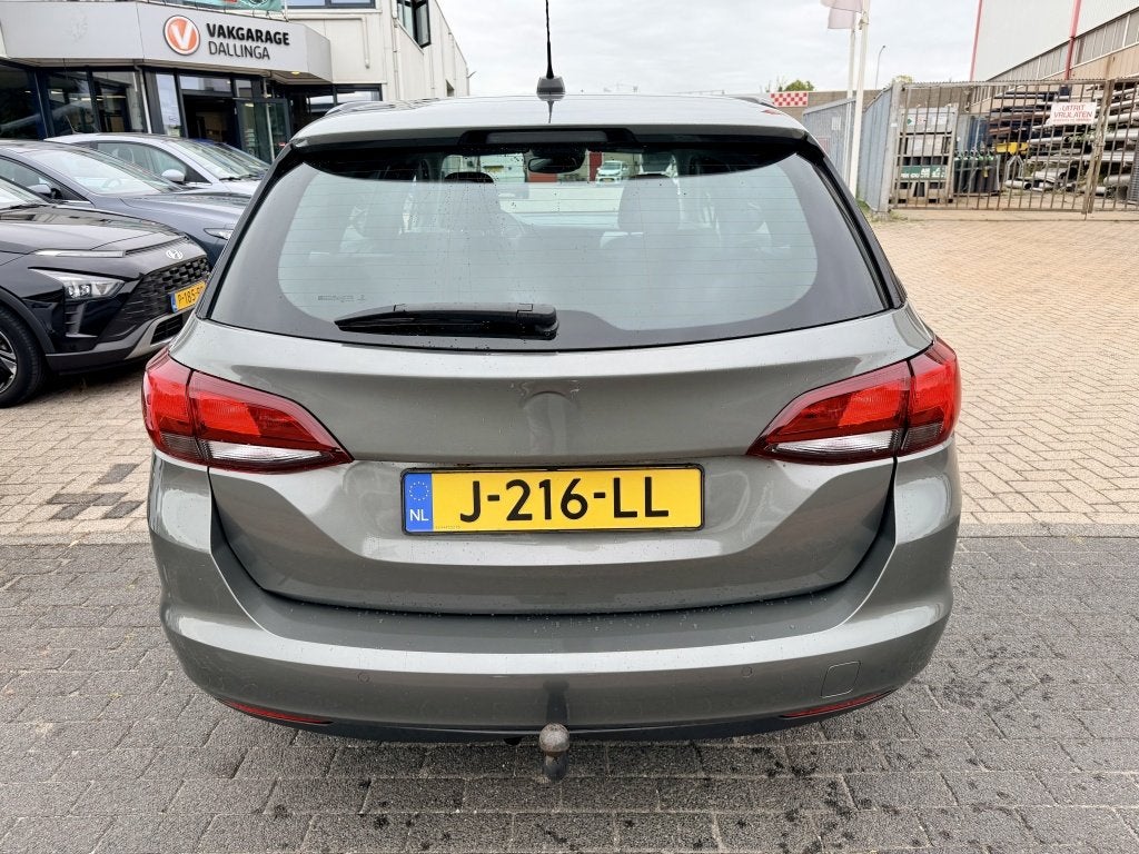 Opel Astra Sports Tourer 1.4 Business Edition (bj 2020), Auto's, Opel, Automaat, Stof, Gebruikt, 146 pk