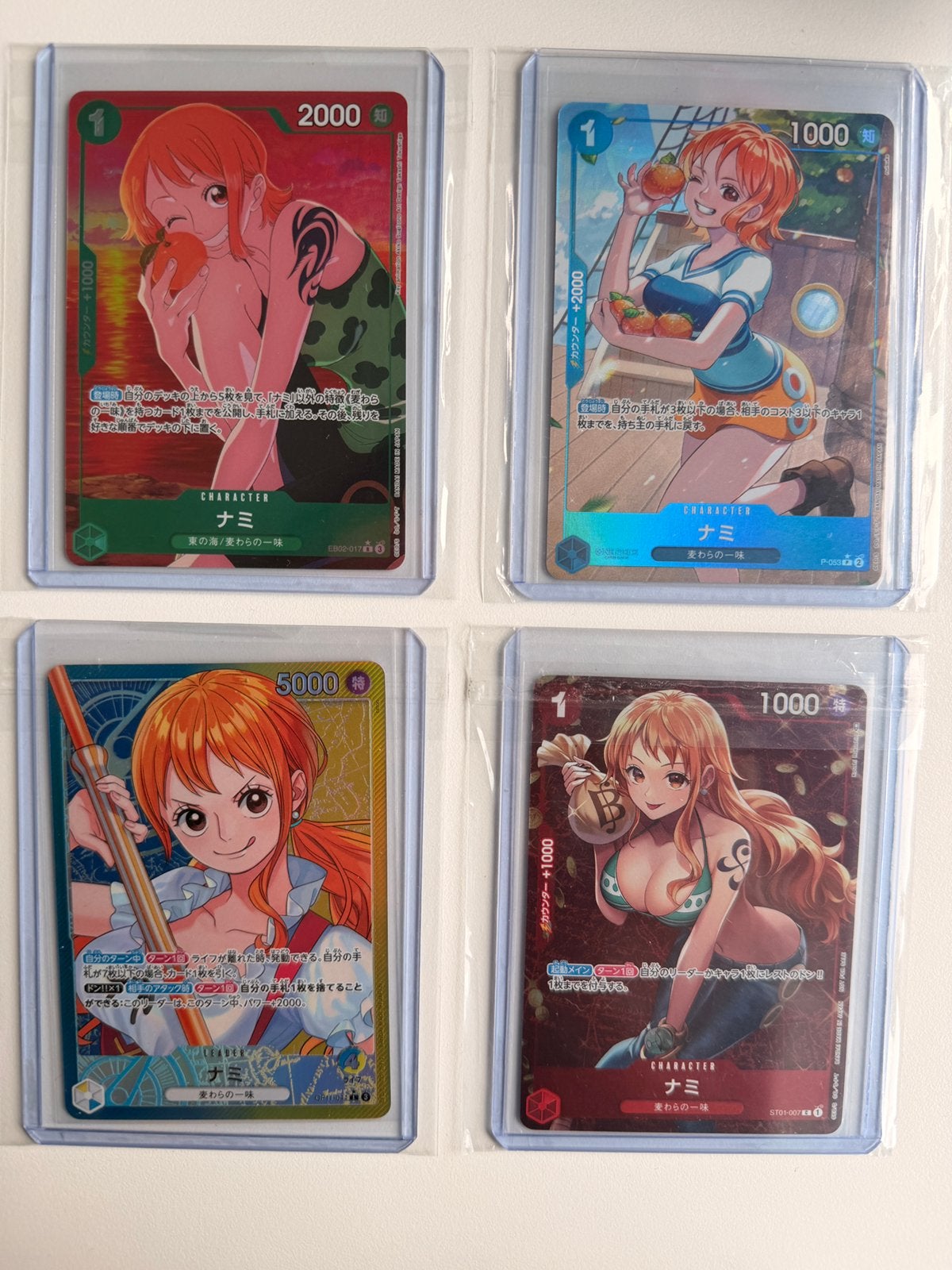 One Piece TCG Nami Card Set (4 Cards) with Official Sleeves, Ophalen of Verzenden, Zo goed als nieuw, Losse kaart, Foil