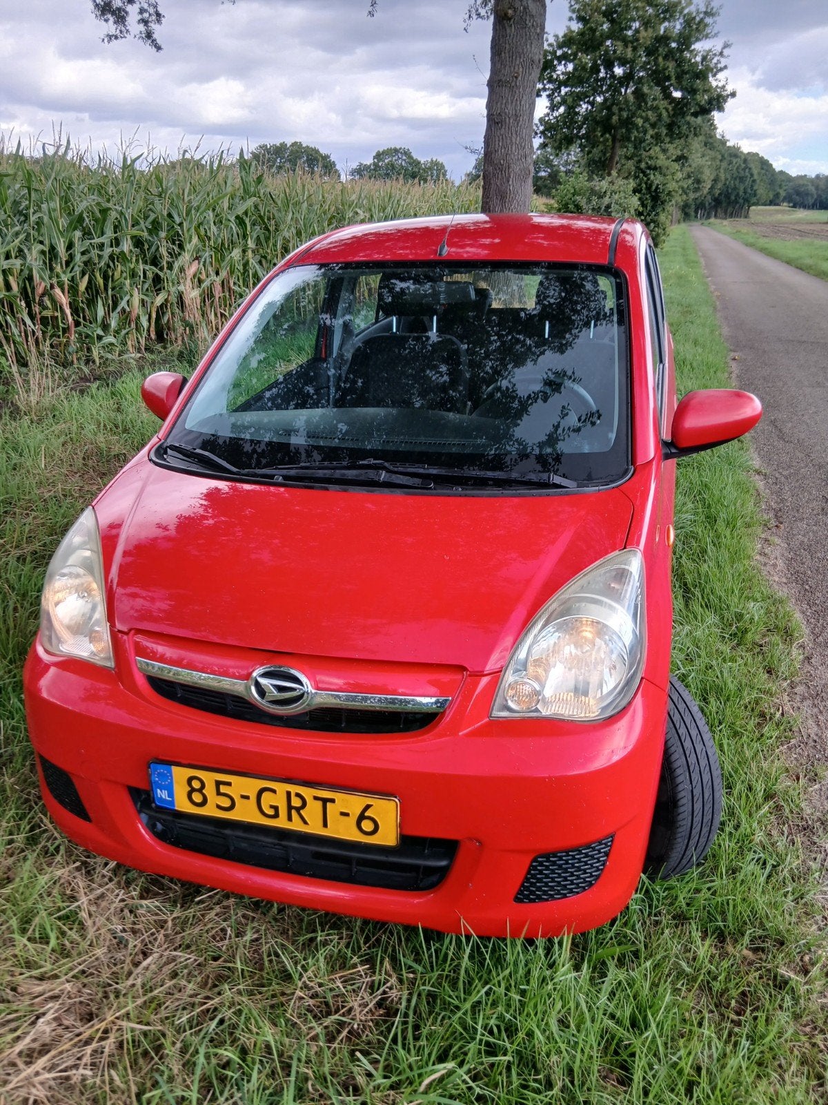Daihatsu Cuore 1.0 5D 2008 Rood met nieuwe apk, Voorwielaandrijving, 600 kg, 18 €/maand, 4 stoelen