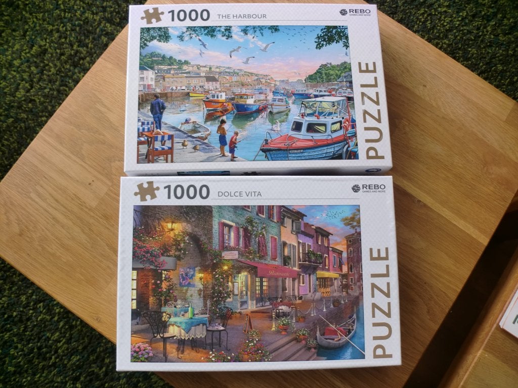 Set van 2 REBO legpuzzels, 1000 stukjes, compleet, Ophalen of Verzenden, 500 t/m 1500 stukjes, Zo goed als nieuw, Legpuzzel