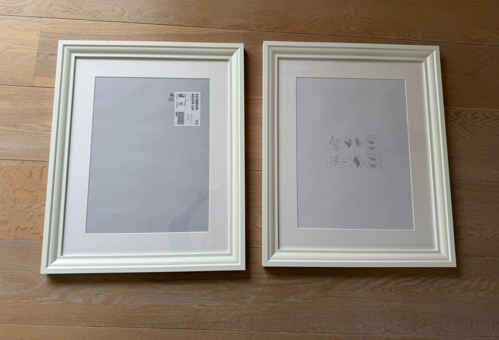 2 IKEA Edsbruk fotolijsten 40x50, Ophalen of Verzenden, Zo goed als nieuw, Wissellijst