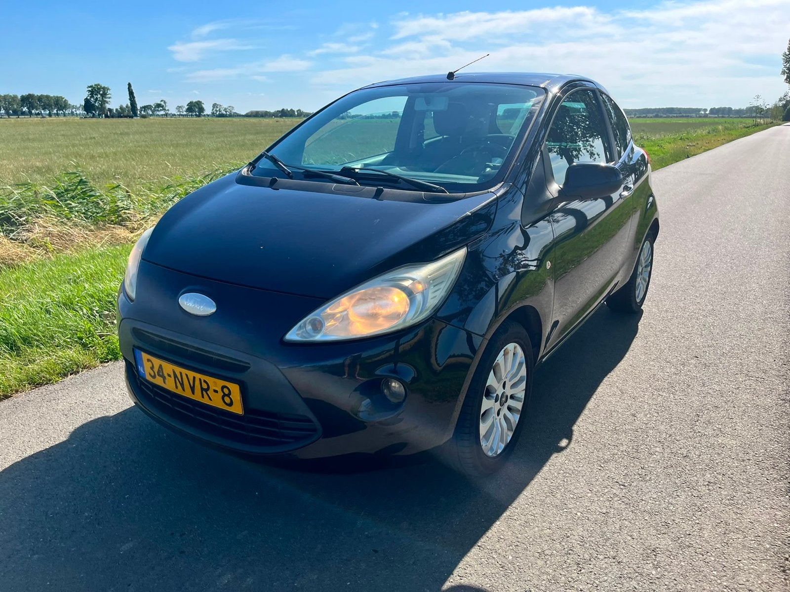 Ford Ka 1.2 51KW 2010 Zwart, Auto's, Voorwielaandrijving, 1242 cc, 4 cilinders, 4 stoelen