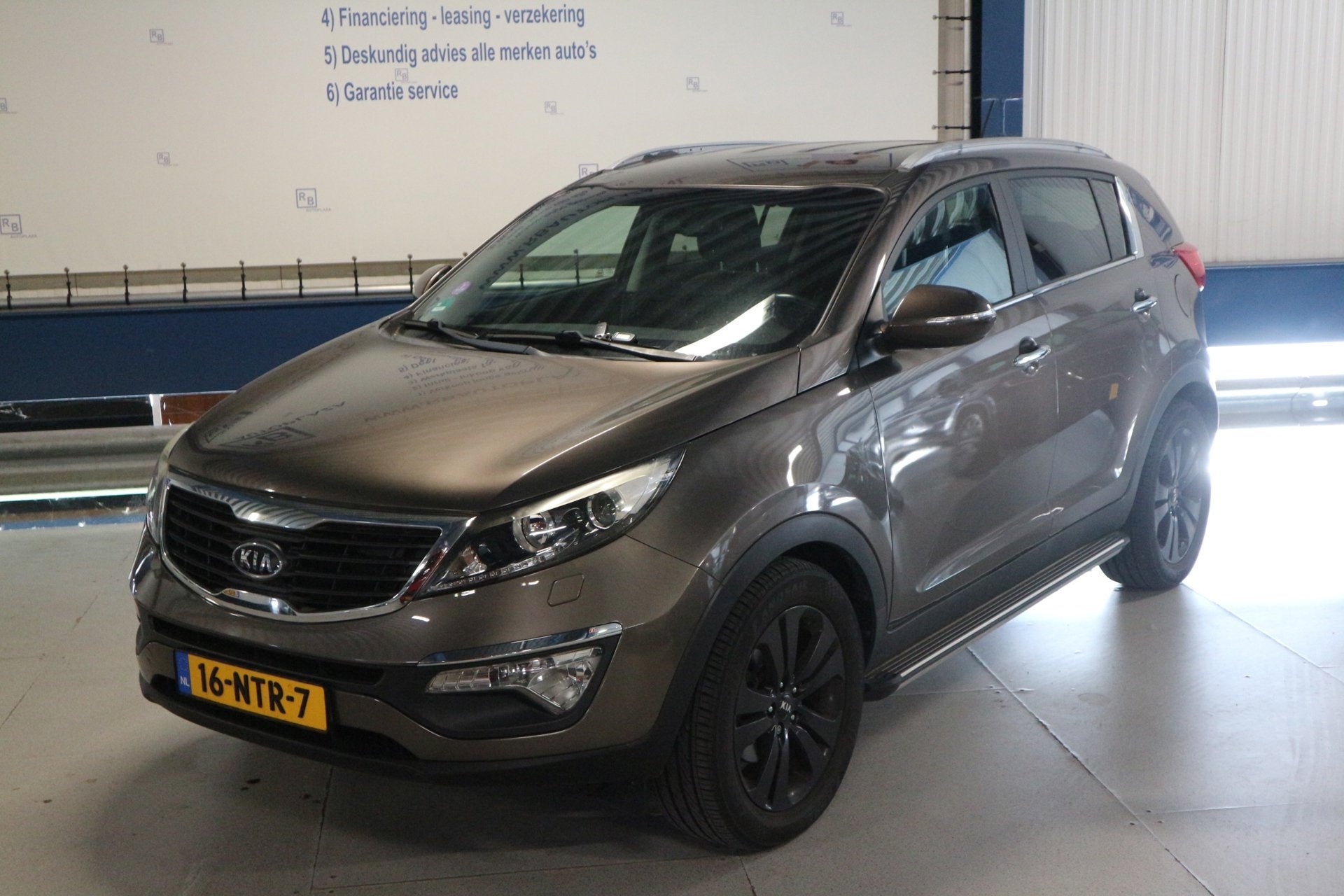 Kia Sportage 2.0 X-clusive / AUTOMAAT / LEER / NAV ! ! !, Gebruikt, 4 cilinders, Bruin, 163 pk