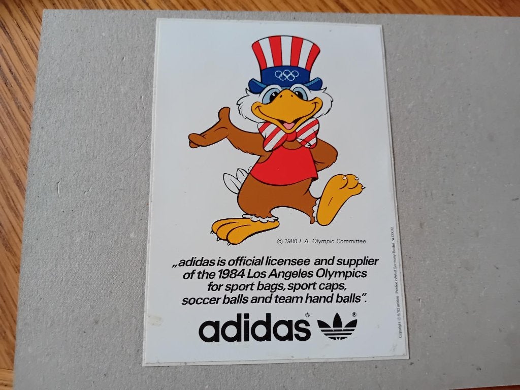 Adidas sticker 1980 licentiehouder 1984 Los Angeles Olympics, Ophalen of Verzenden, Zo goed als nieuw, Bedrijf of Vereniging