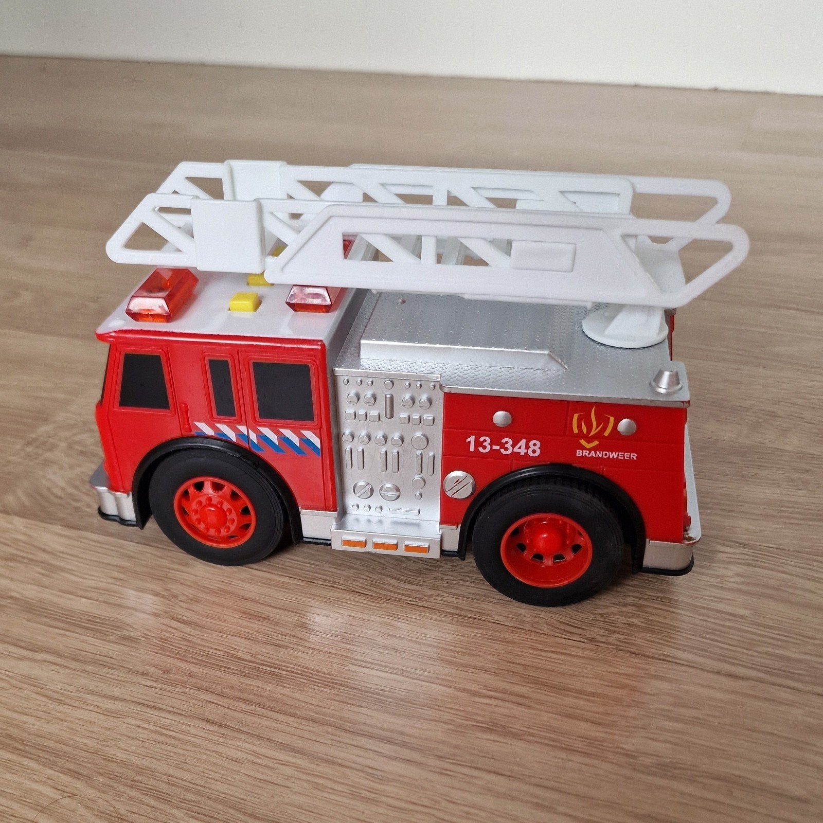 Brandweerauto met geluid en lichteffecten, Ophalen, Zo goed als nieuw