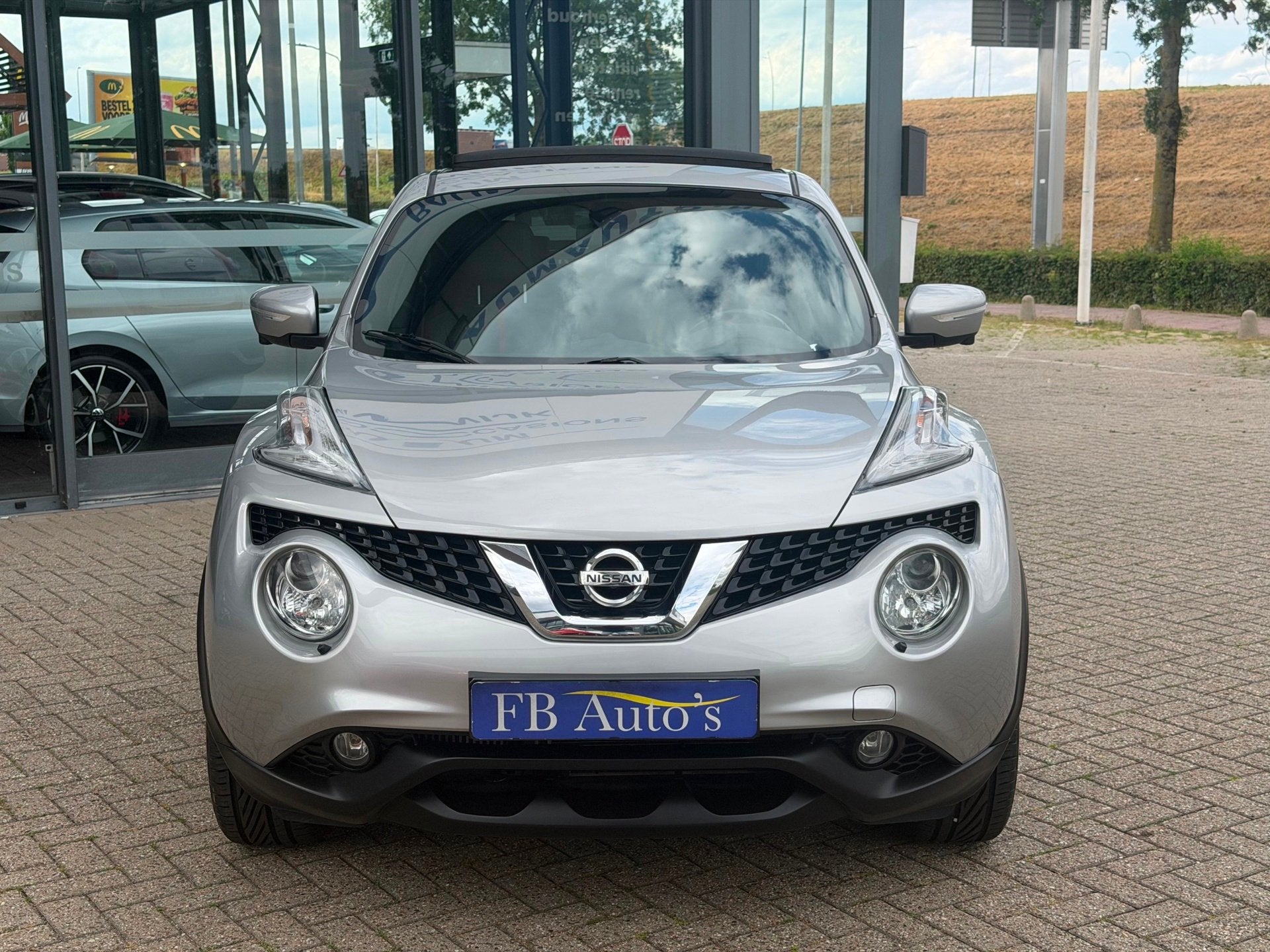 Nissan Juke 1.2 DIG-T S/S Tekna Airco Lmv Cruise Navi Camera, Auto's, Nissan, Voorwielaandrijving, Gebruikt, Zwart, 116 pk