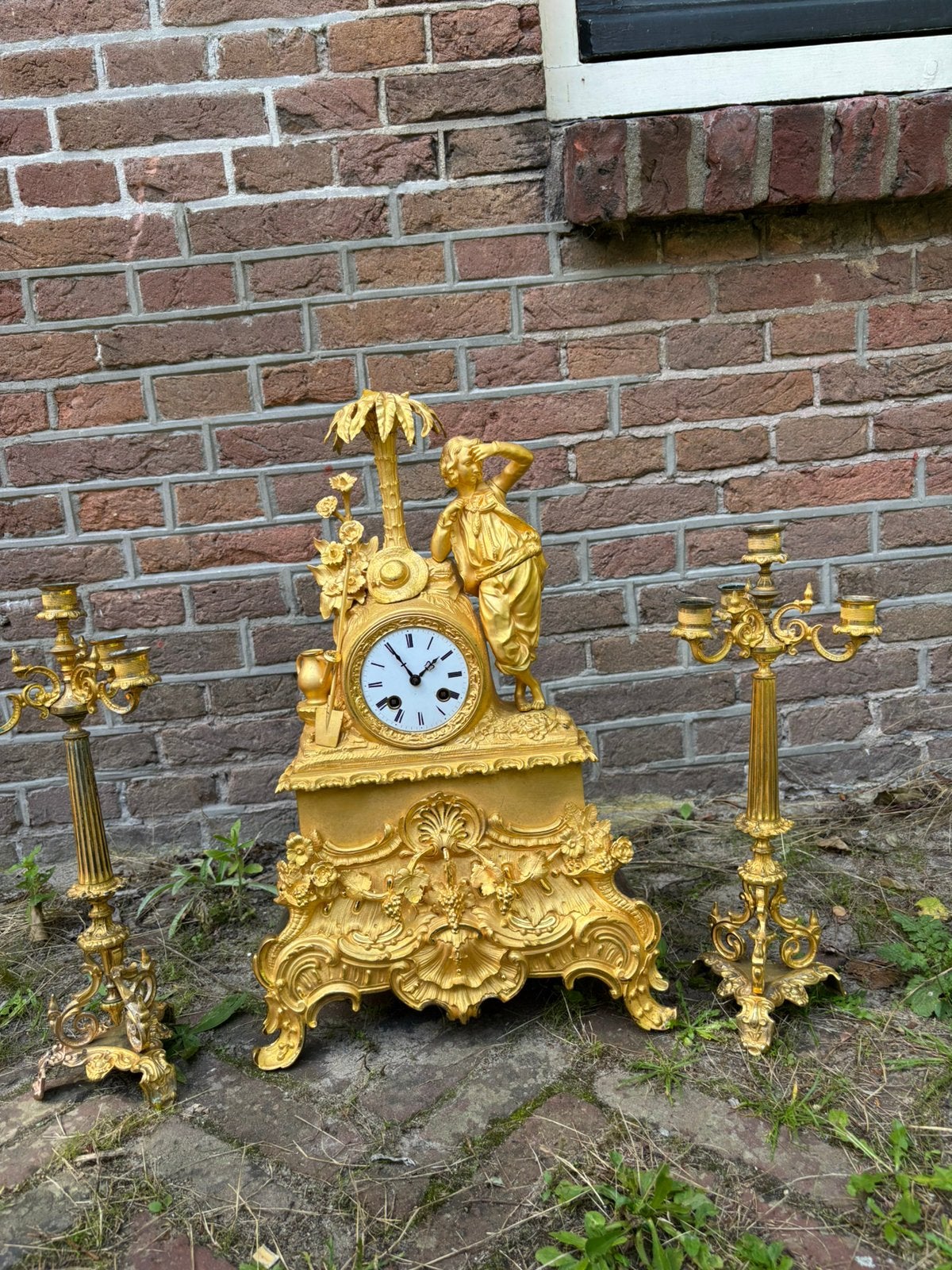 Vuur vergulde pendule met candelabra, Ophalen