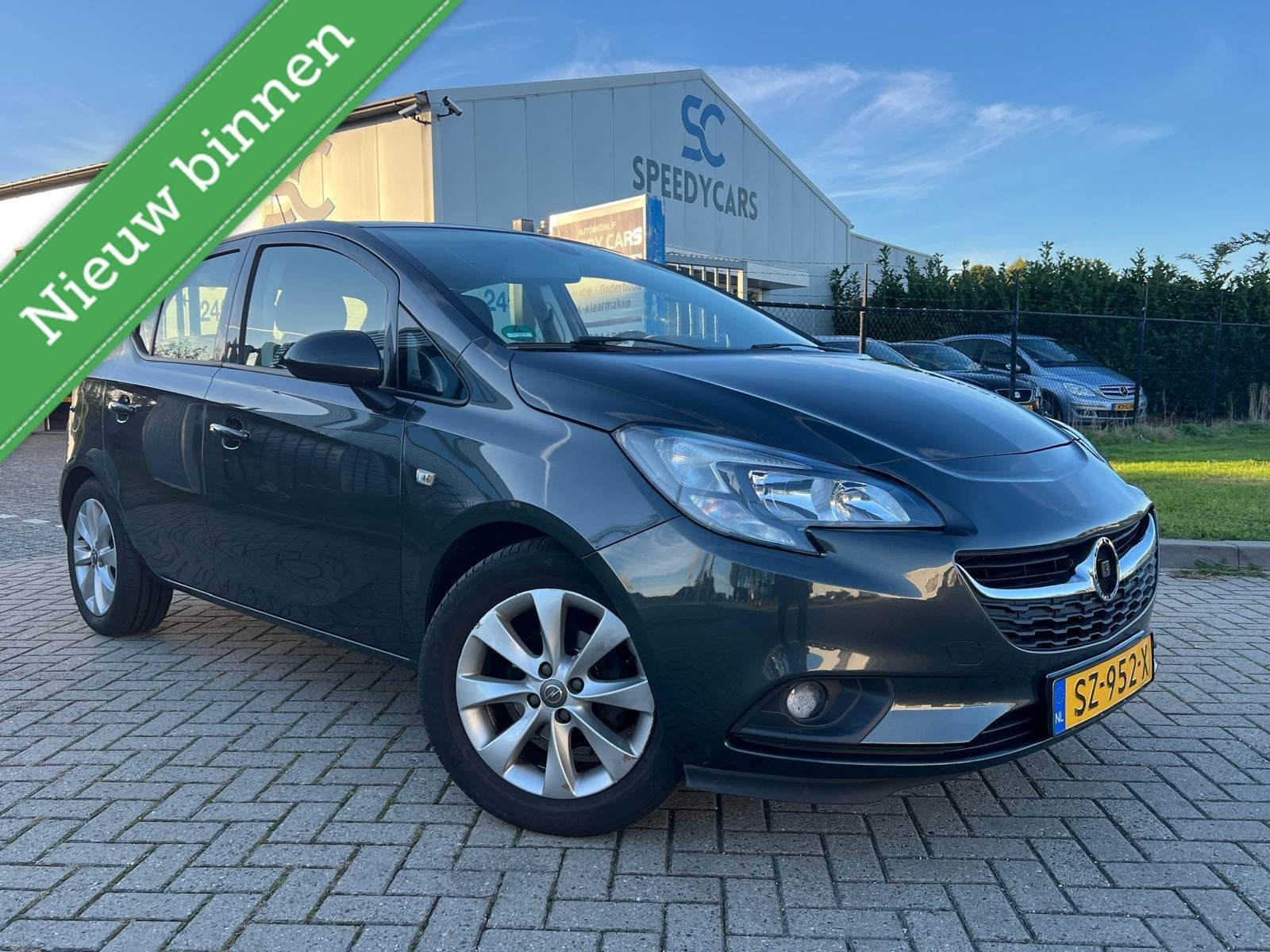 Opel Corsa 1.4 120 Jaar Edition LPG G3 5DRS Cruise Navi PDC, Voorwielaandrijving, Stof, Gebruikt, 4 cilinders