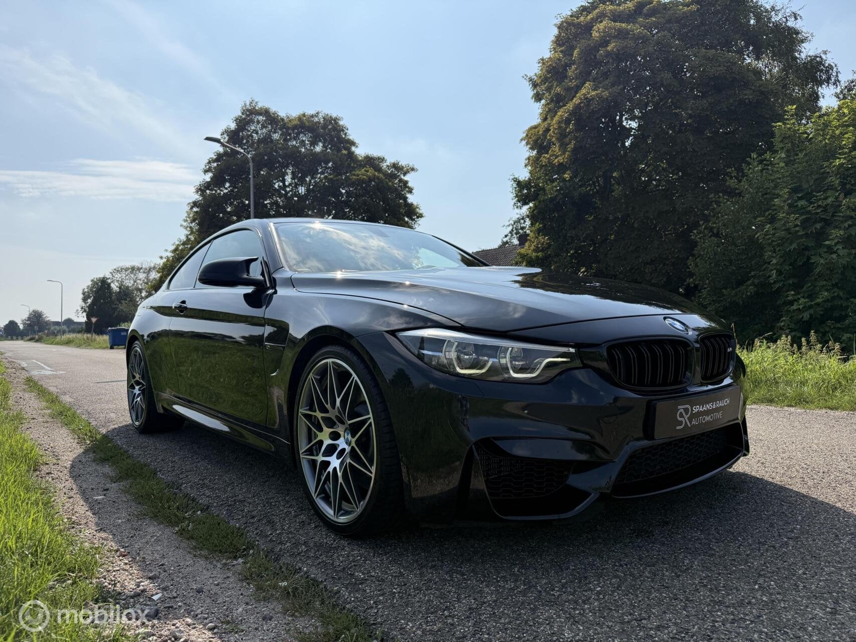 BMW M4 Competition Coupé / Carbon / HUD / Harman / Leder, Auto's, Automaat, Dealer onderhouden, Achterwielaandrijving, Zwart