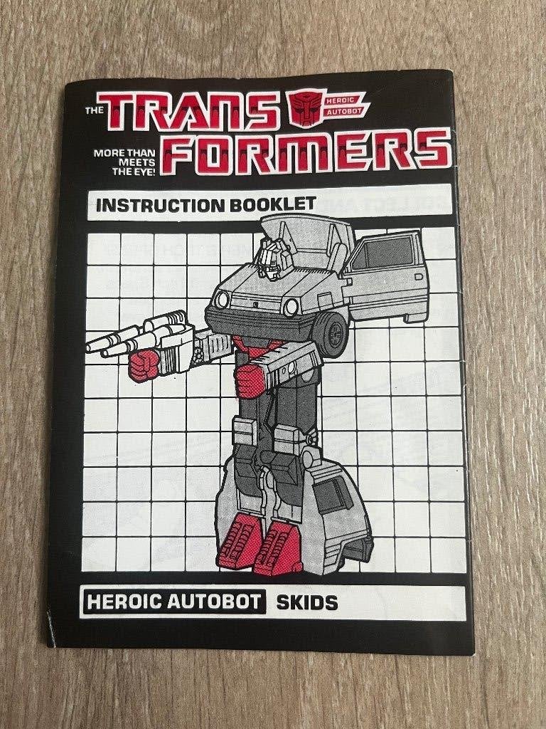Transformers G1: Skids US/UK rub instruction 1985, Verzamelen, Transformers, G1, Ophalen of Verzenden, Gebruikt, Autobots