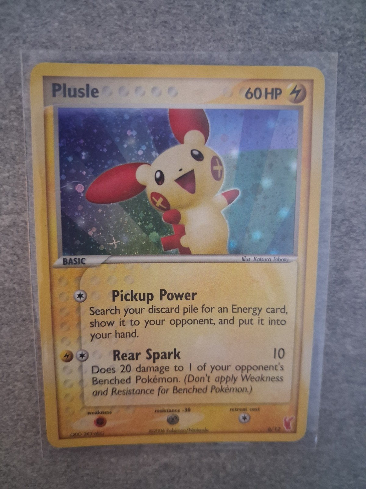 Plusle Pokemon Kaart - Holo - 6/12 2006, Ophalen of Verzenden, Zo goed als nieuw, Losse kaart, Foil