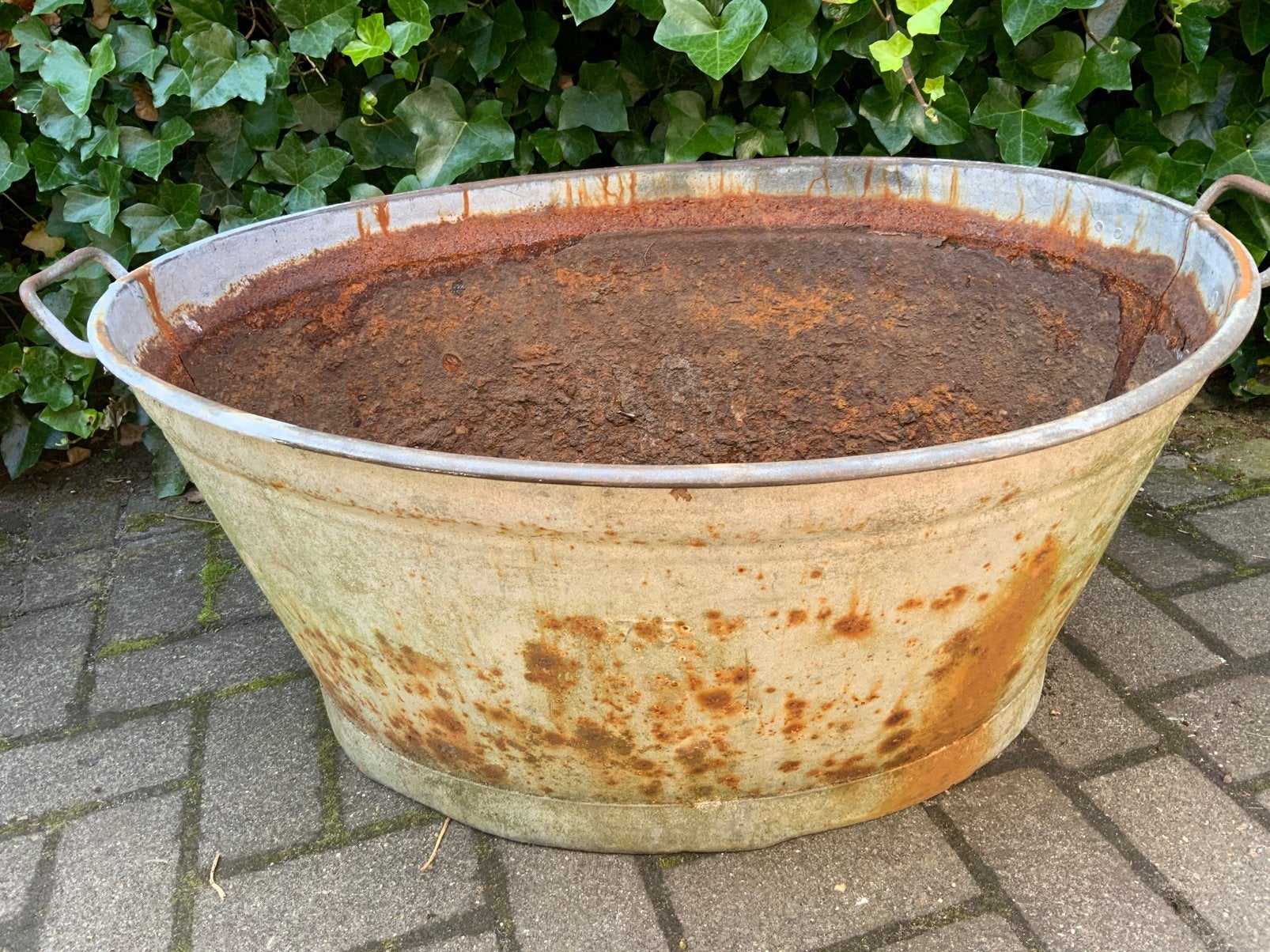 Hele grote zinken teil, Ophalen