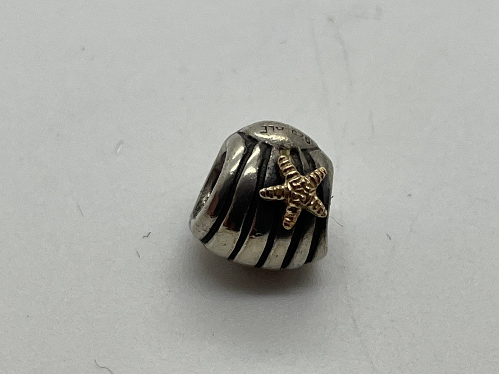 F80 Pandora goud op zilveren stopper bedel zeester, Sieraden, Tassen en Uiterlijk, Bedels, Pandora, Ophalen of Verzenden, X, Zilver