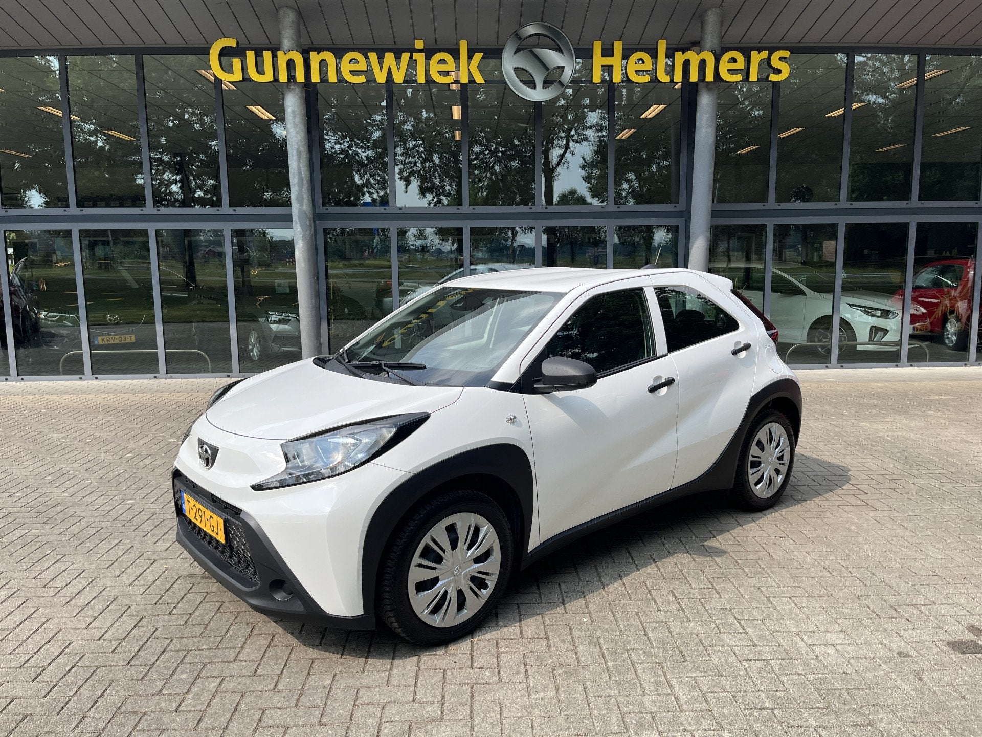 Toyota Aygo X 1.0 VVT-i MT | ADAPT. CRUISE | AIRCO | CARPLAY, Auto's, Stof, Gebruikt, 4 stoelen, Wit