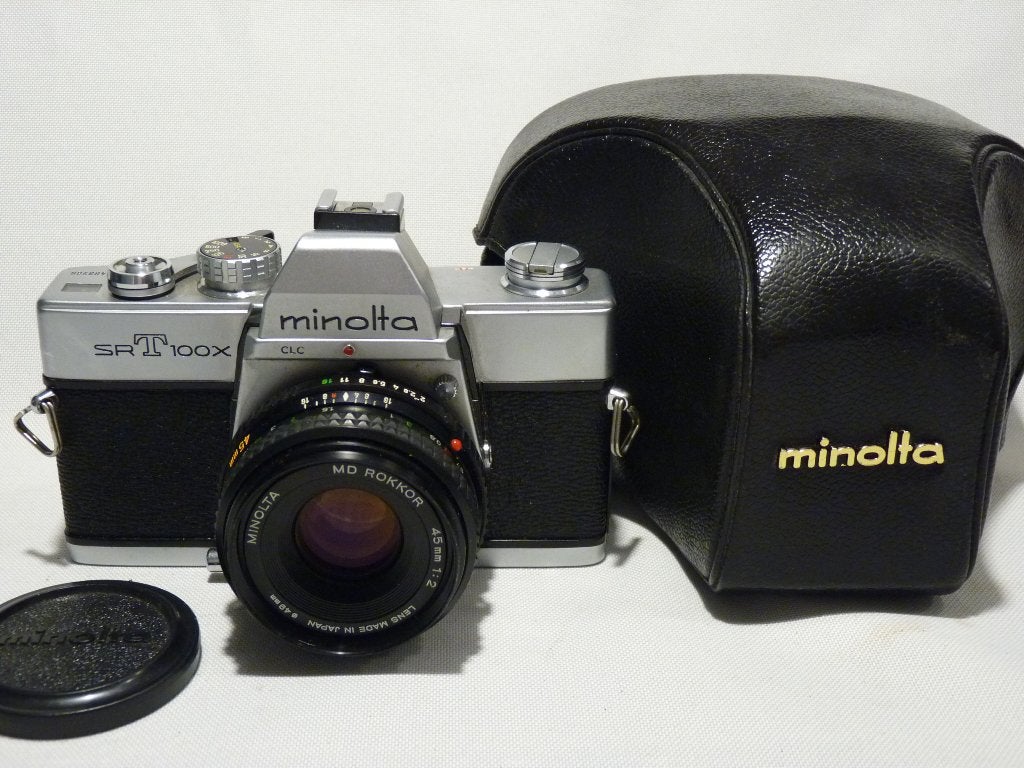 Minolta SRT 100X MD Rokkor 2.0/49mm, dop en paraattas 1977, Audio, Tv en Foto, Ophalen of Verzenden, Zo goed als nieuw, Spiegelreflex