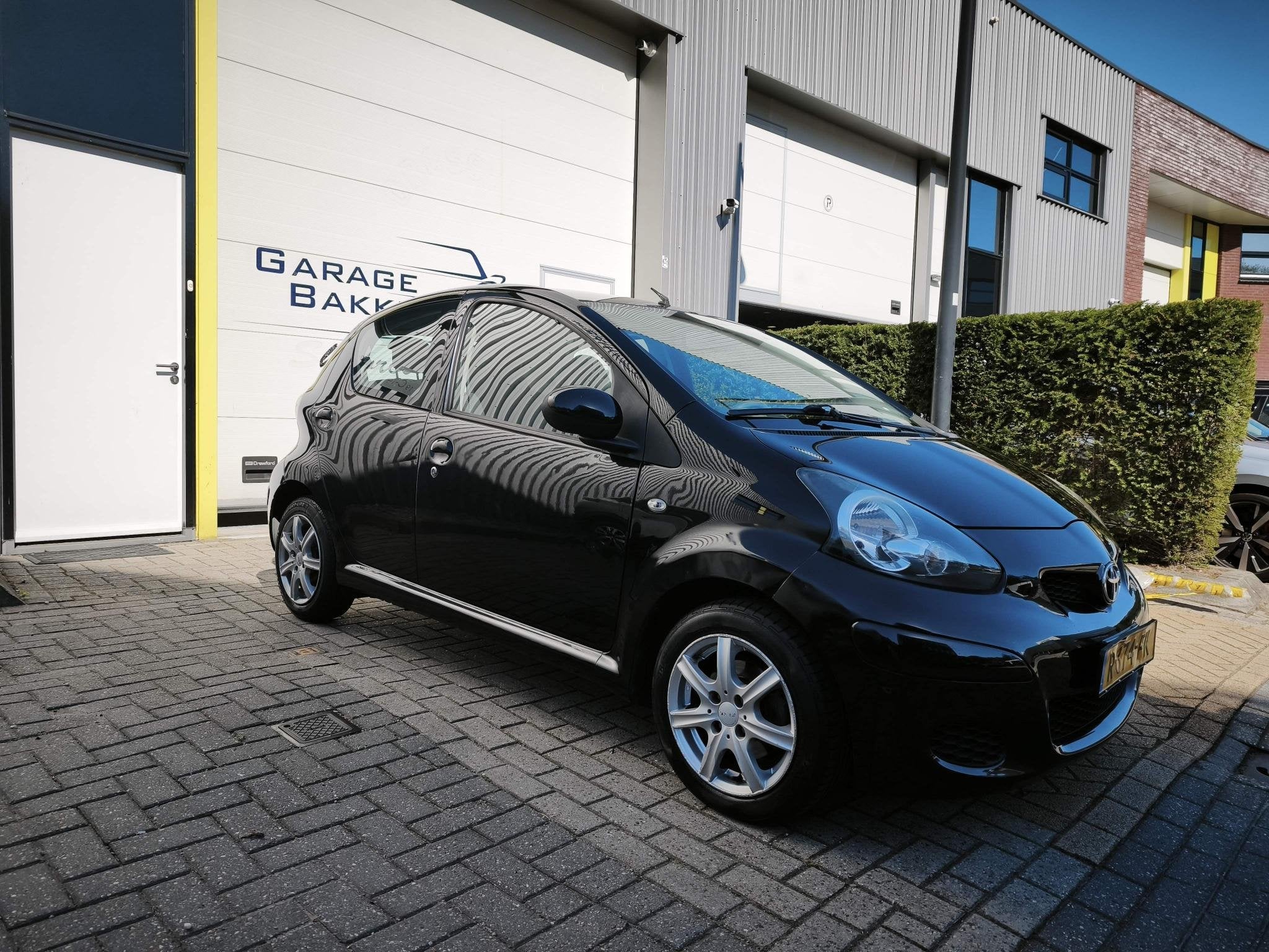 Toyota Aygo 1.0-12V Comfort Airco 5 Deurs, Auto diversen, Postbus 212
4940 AE  Raamsdonksveer, NL, Zwart, Handgeschakeld, Toyota