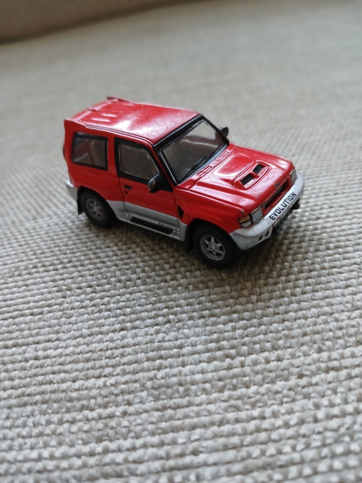 Mitsubishi Pajero Evolution rood, Ophalen of Verzenden, Gebruikt, Auto