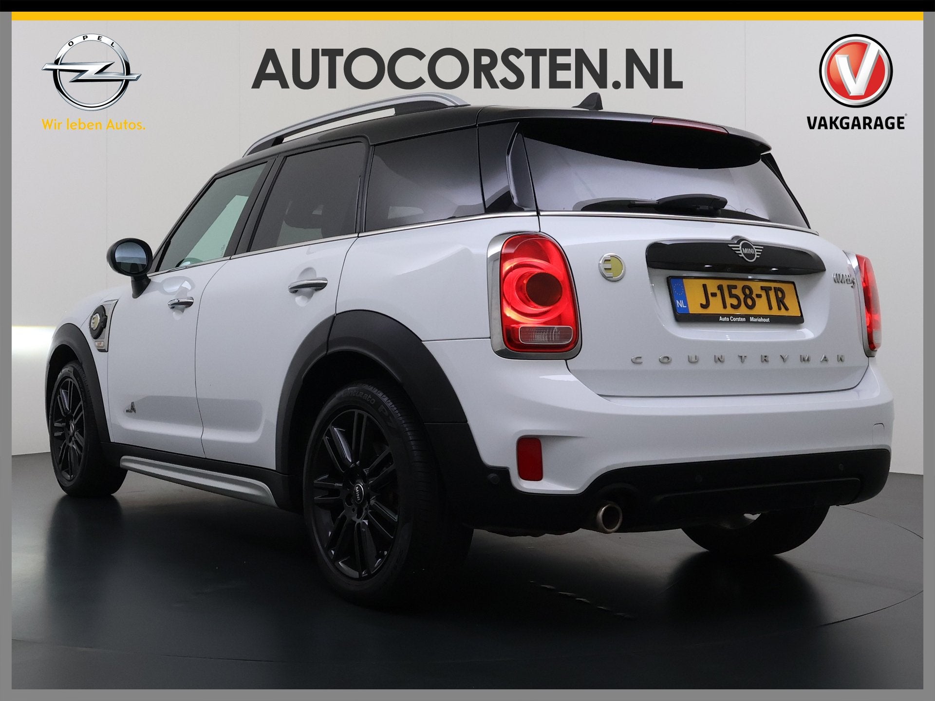 MINI Countryman 224PK Hybrid Automaat Cooper S E ALL4 Chili, Auto's, Verwarmde buitenspiegels, Gebruikt, Leder en Stof, Wit