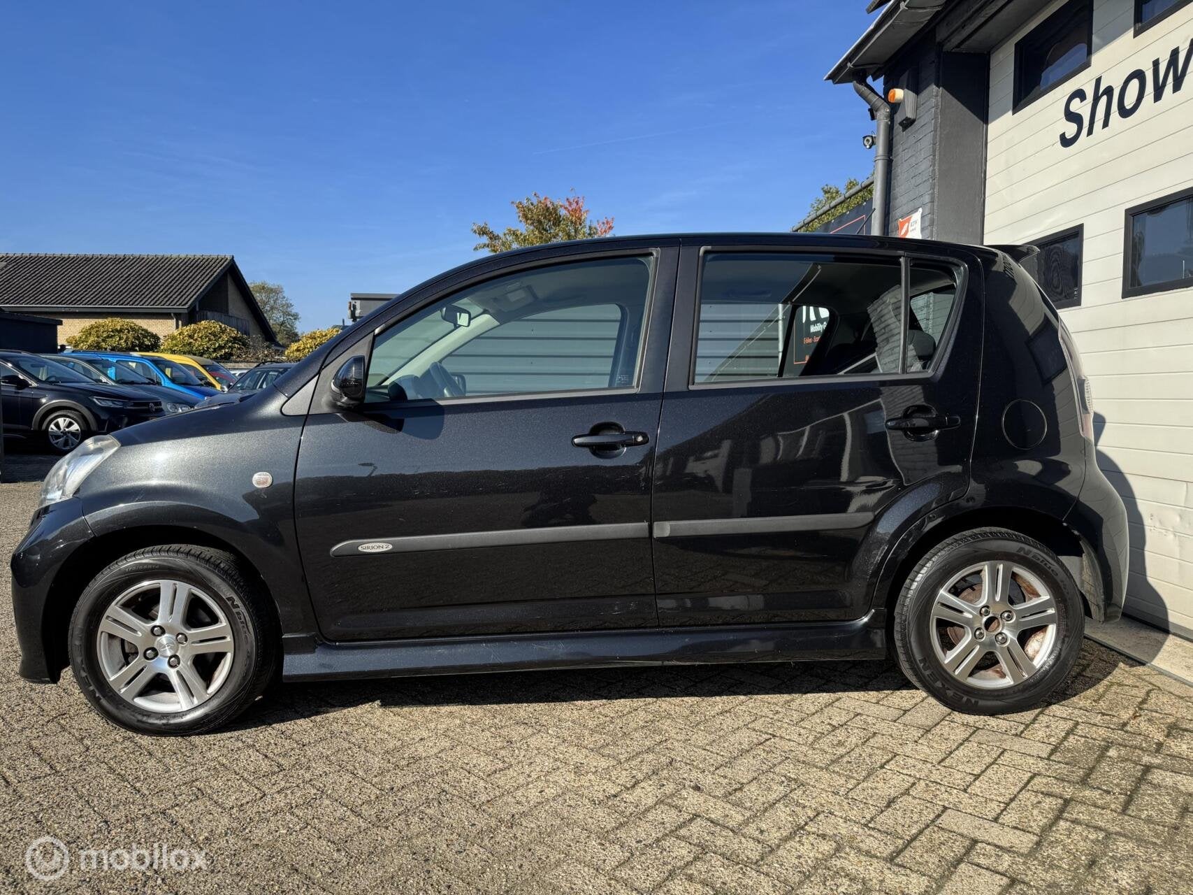 Daihatsu Sirion 2 1.3-16V Comfort *AUTOMAAT*NIEUWE APK*AIRCO, Auto's, Gebruikt, 31 €/maand, 4 cilinders, Zwart