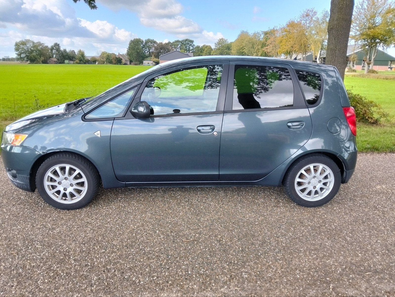 Mitsubishi Colt 1.3 5-DR 2011 Grijs, Auto's, Voorwielaandrijving, 31 €/maand, Colt, Origineel Nederlands
