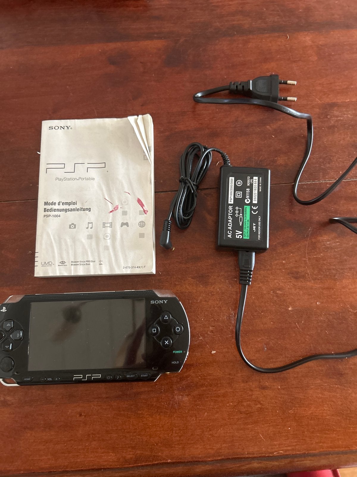 Sony PSP-1004 met batterij en nieuwe oplader, Ophalen of Verzenden, Gebruikt, Zwart, PSP