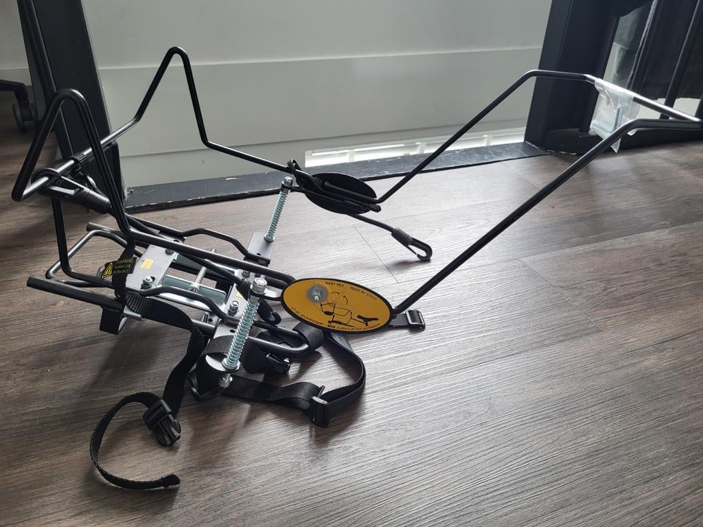 Maxicosi houder bakfiets, Ophalen
