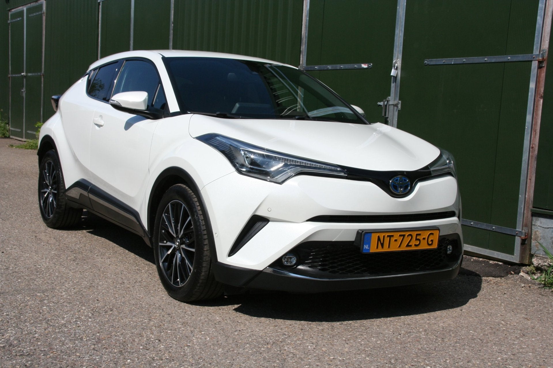 Toyota C-HR 1.8 Hybrid Premium Excecutive, LEER, NAVIGATIE,, Auto's, Dealer onderhouden, 4 cilinders, Leder en Stof, Wit