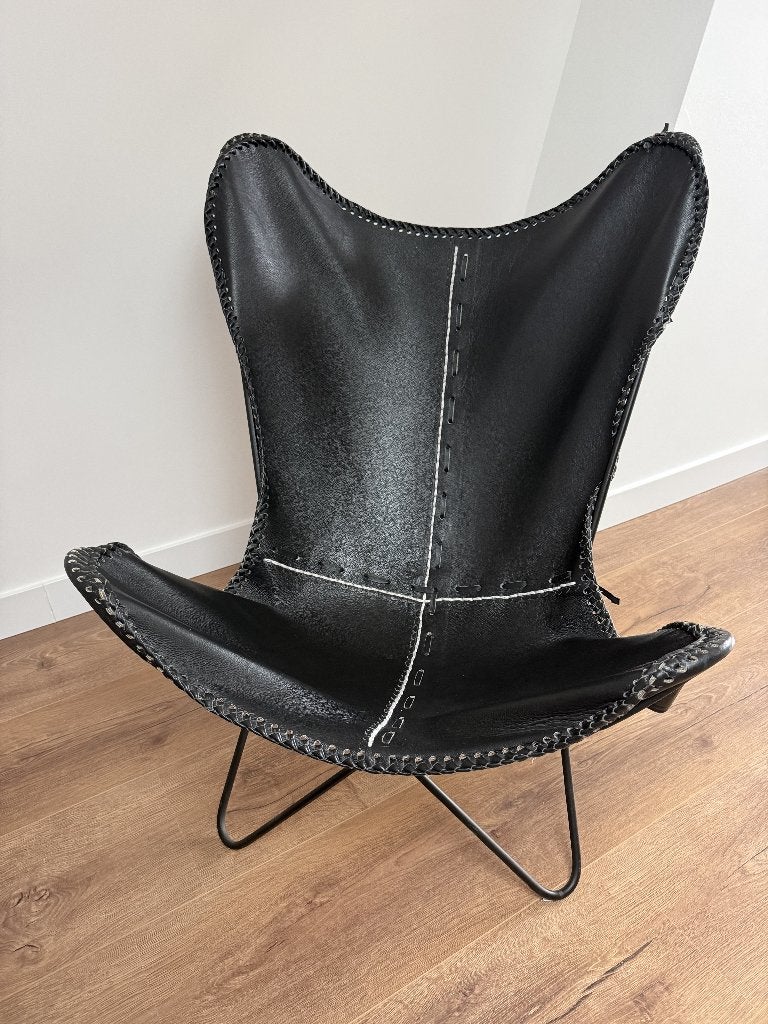 Vlinderstoel zwart leer, Huis en Inrichting, Stoelen, Ophalen, Zwart, Zo goed als nieuw, Eén
