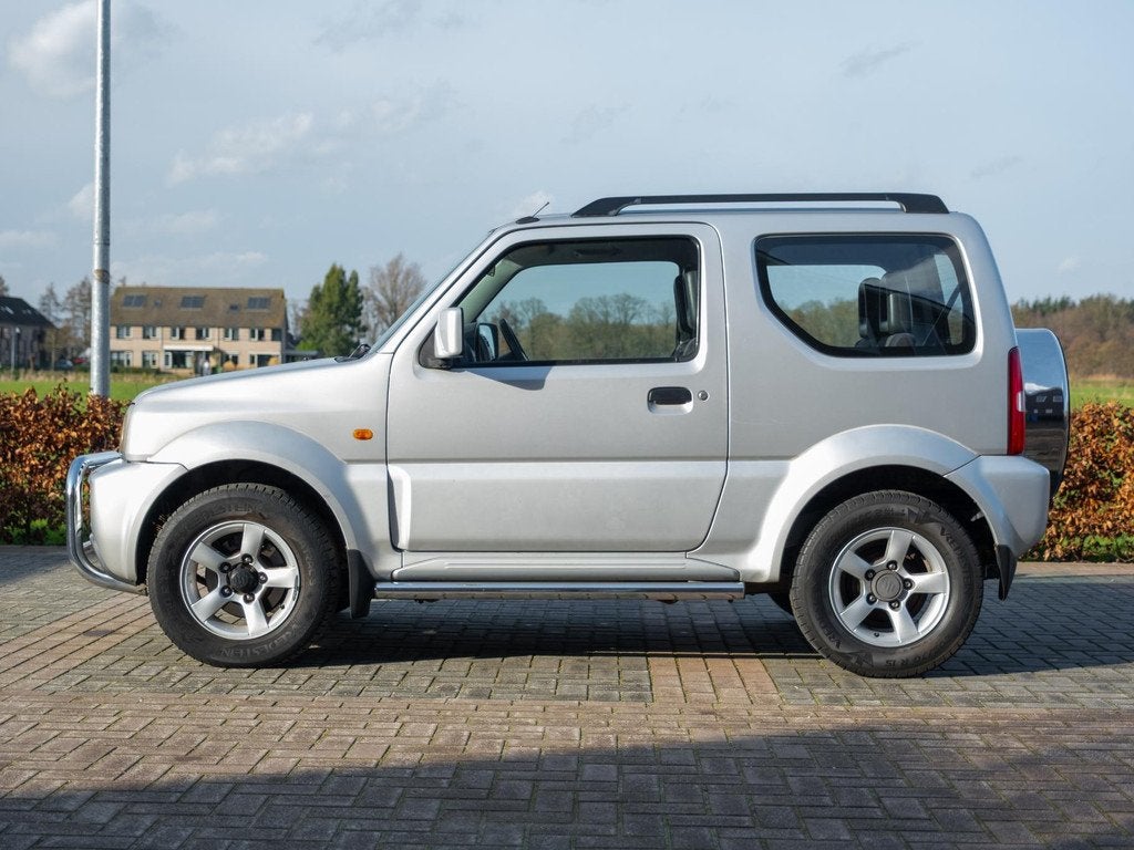 Suzuki Jimny 1.3 Exclusive | 1 eig! | Airco | Afn Trekhaak |, Auto's, Suzuki, Euro 5, Zwart, 4 stoelen, Origineel Nederlands