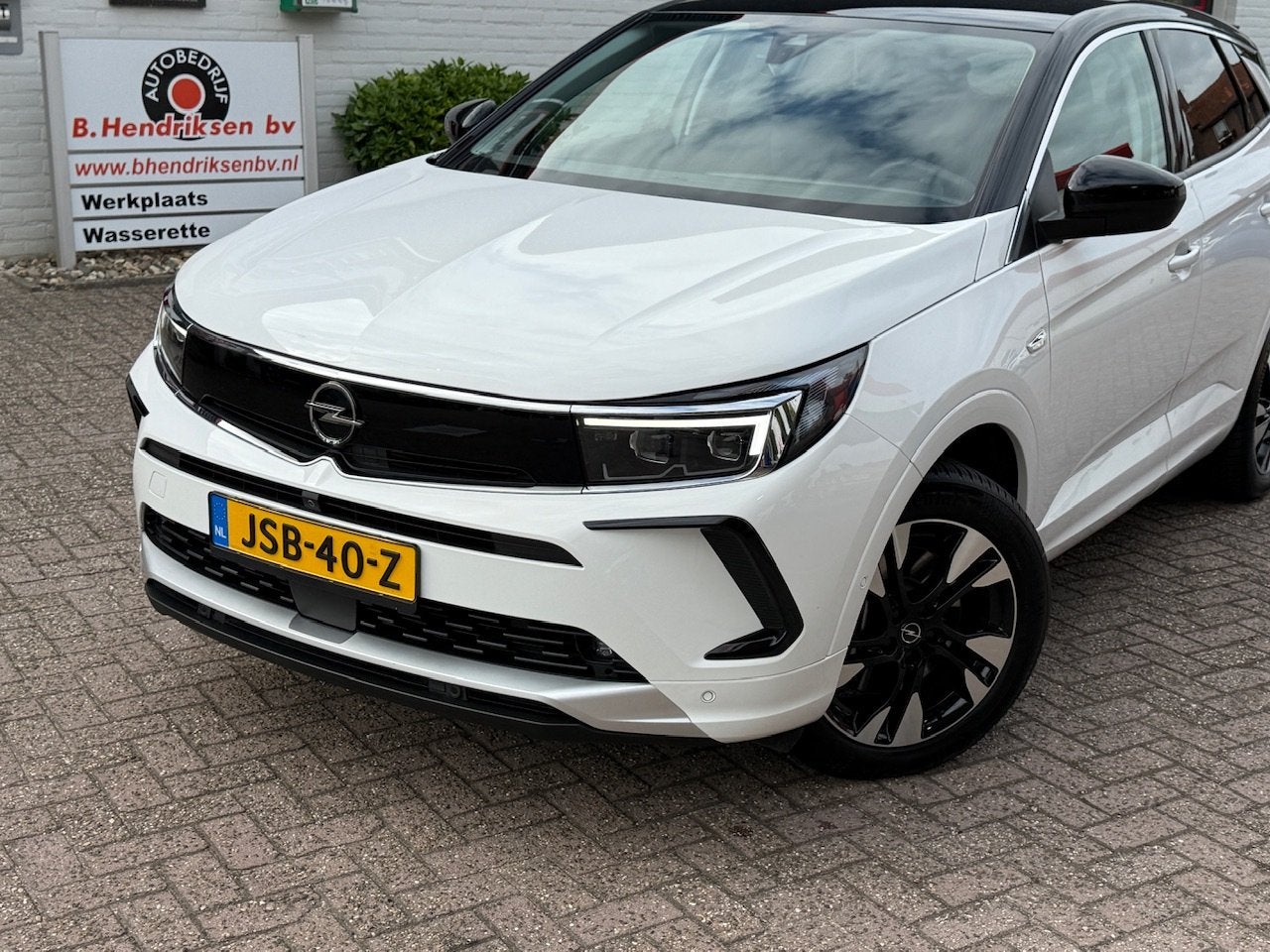 Opel Grandland 1.6 Turbo Hybrid 225pk Aut Ultimate/ SOH 99.2, Auto's, Dealer onderhouden, 4 cilinders, Wit, Bedrijf