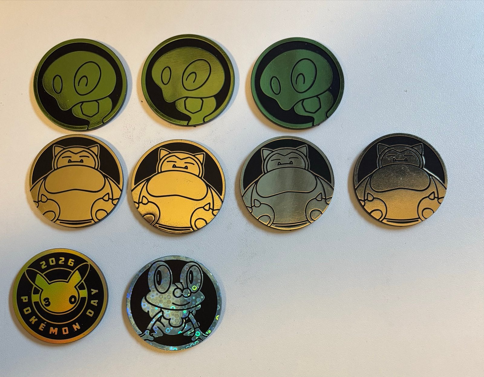 Diverse Pokémon munten - Snorlax, Froakie, Gastly, Pikachu, Ophalen of Verzenden, Zo goed als nieuw, Overige typen