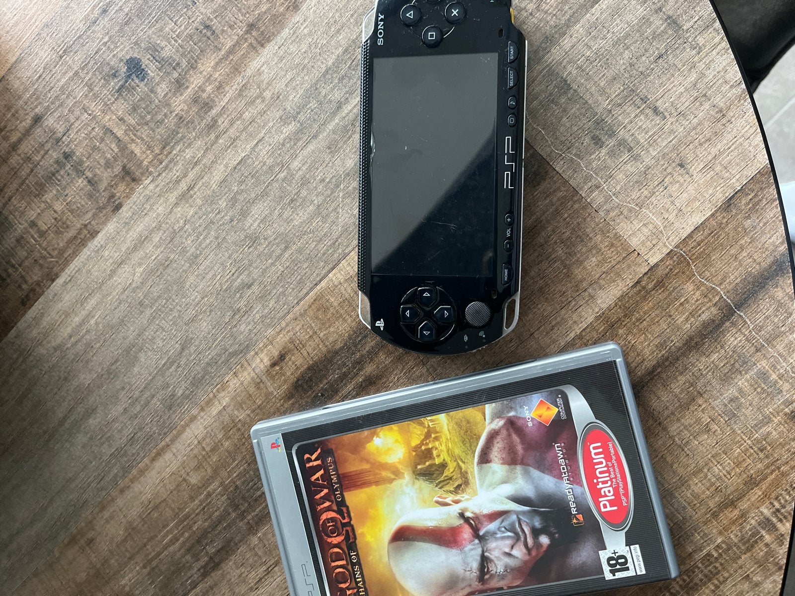 PSP met God of War: Chains of Olympus - Zo goed als nieuw, Spelcomputers en Games, Met games, Zwart, Ophalen of Verzenden, Zo goed als nieuw