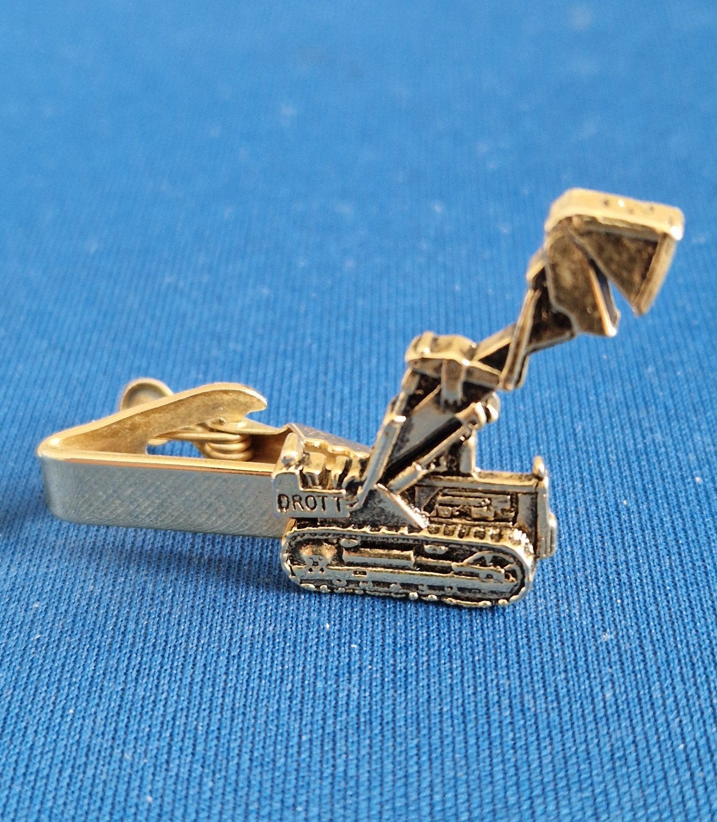 Graafmachine, revers/das-clip, Drott, Sieraden, Tassen en Uiterlijk, Overige Accessoires, Zo goed als nieuw, Ophalen of Verzenden
