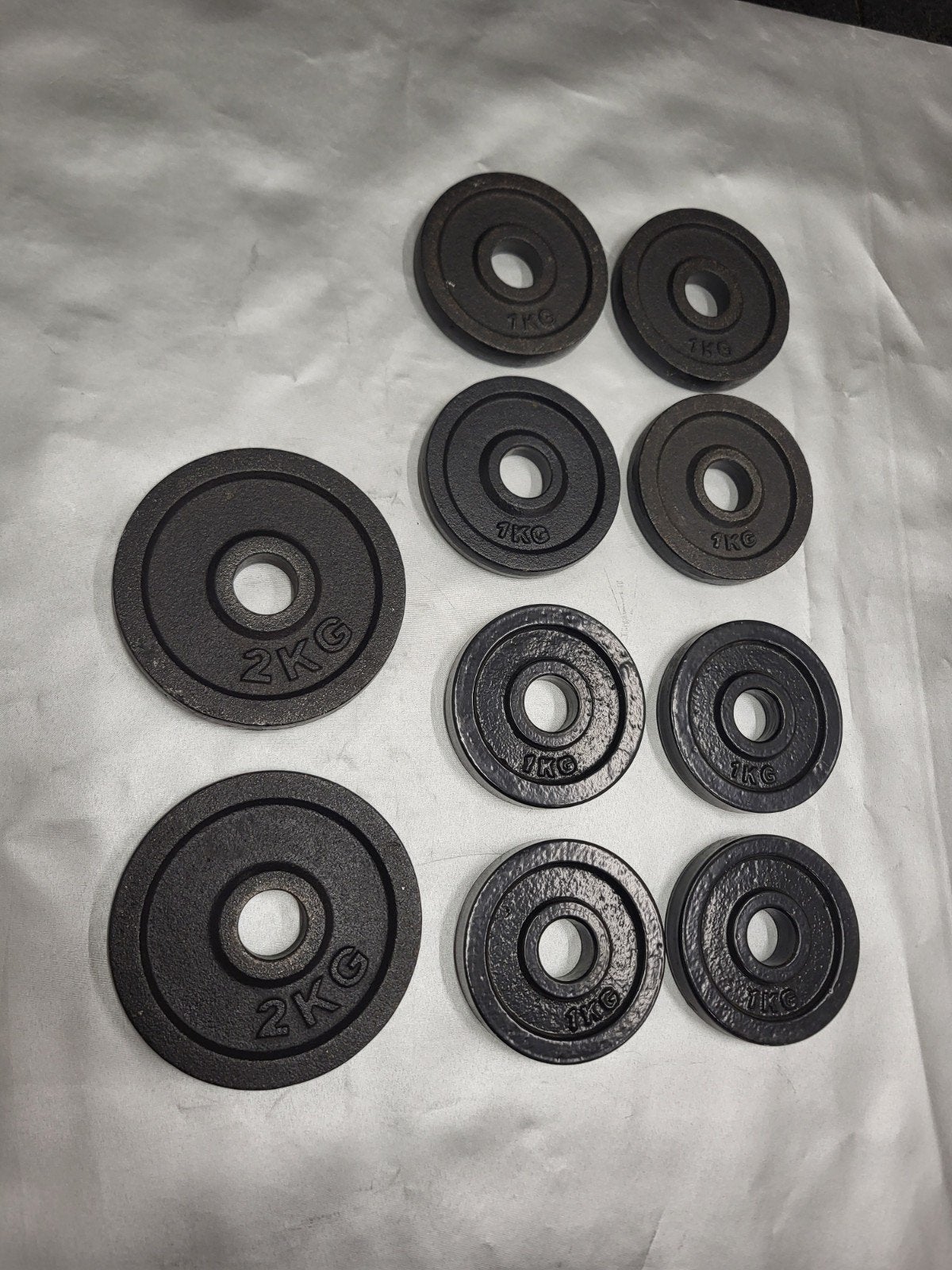30mm gietijzeren schijven voor dumbell of halterstang., Ophalen of Verzenden, Zo goed als nieuw