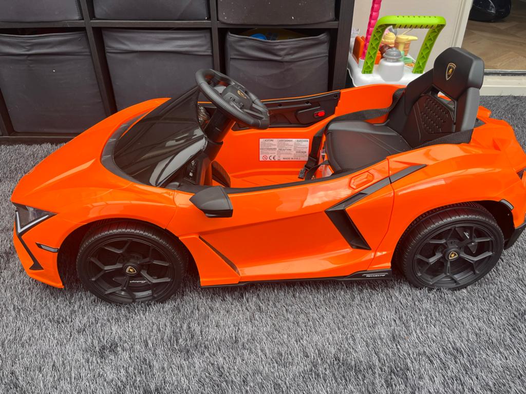 Elektrische kinderauto Lamborghini Revuelto - Oranje, Kinderen en Baby's, Speelgoed | Buiten | Accuvoertuigen, Ophalen, Zo goed als nieuw