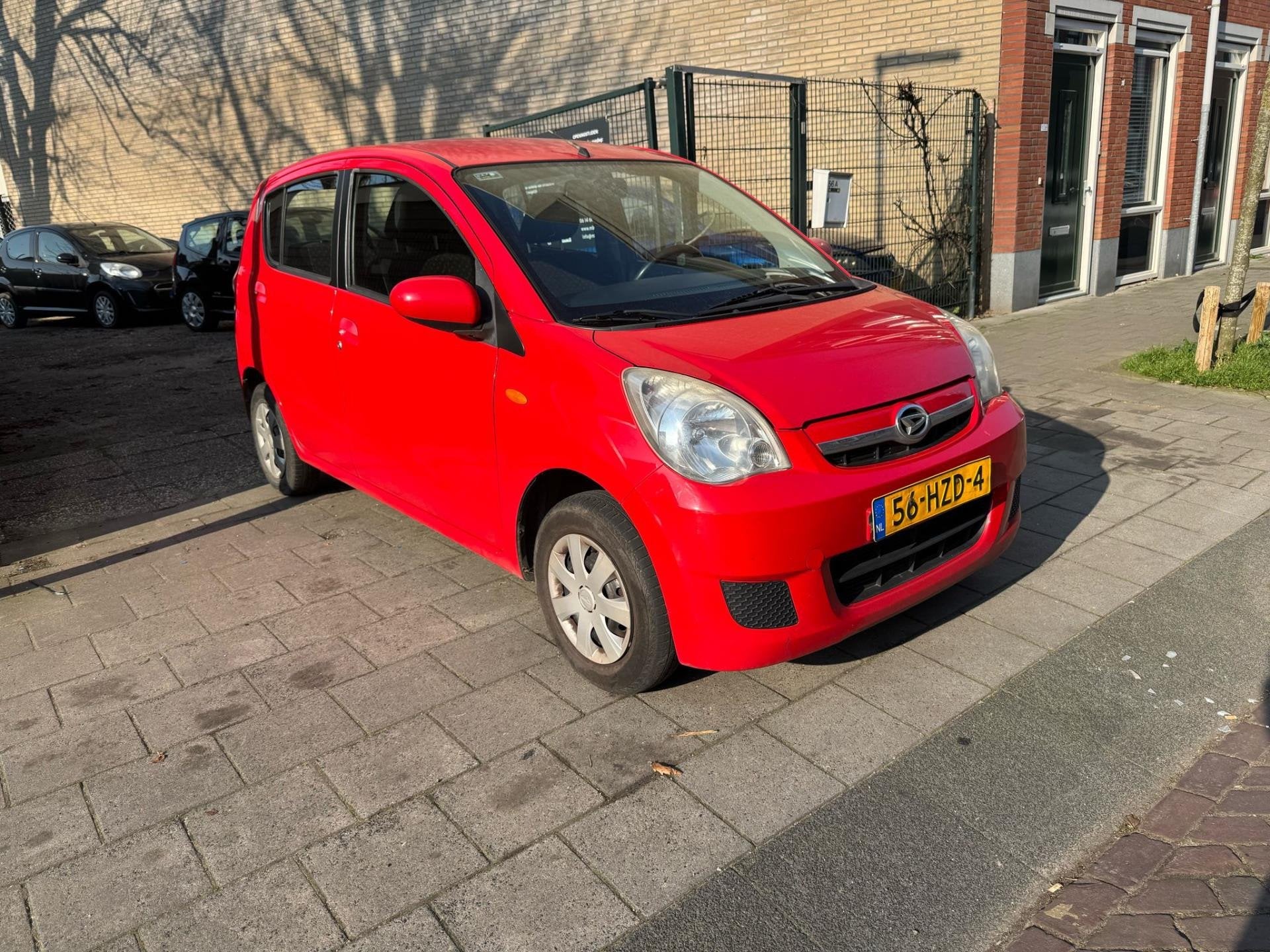 Daihatsu Cuore 1.0 Premium Benzine Handgeschakeld NAP Top au, Auto's, Voorwielaandrijving, Stof, Zwart, 18 €/maand