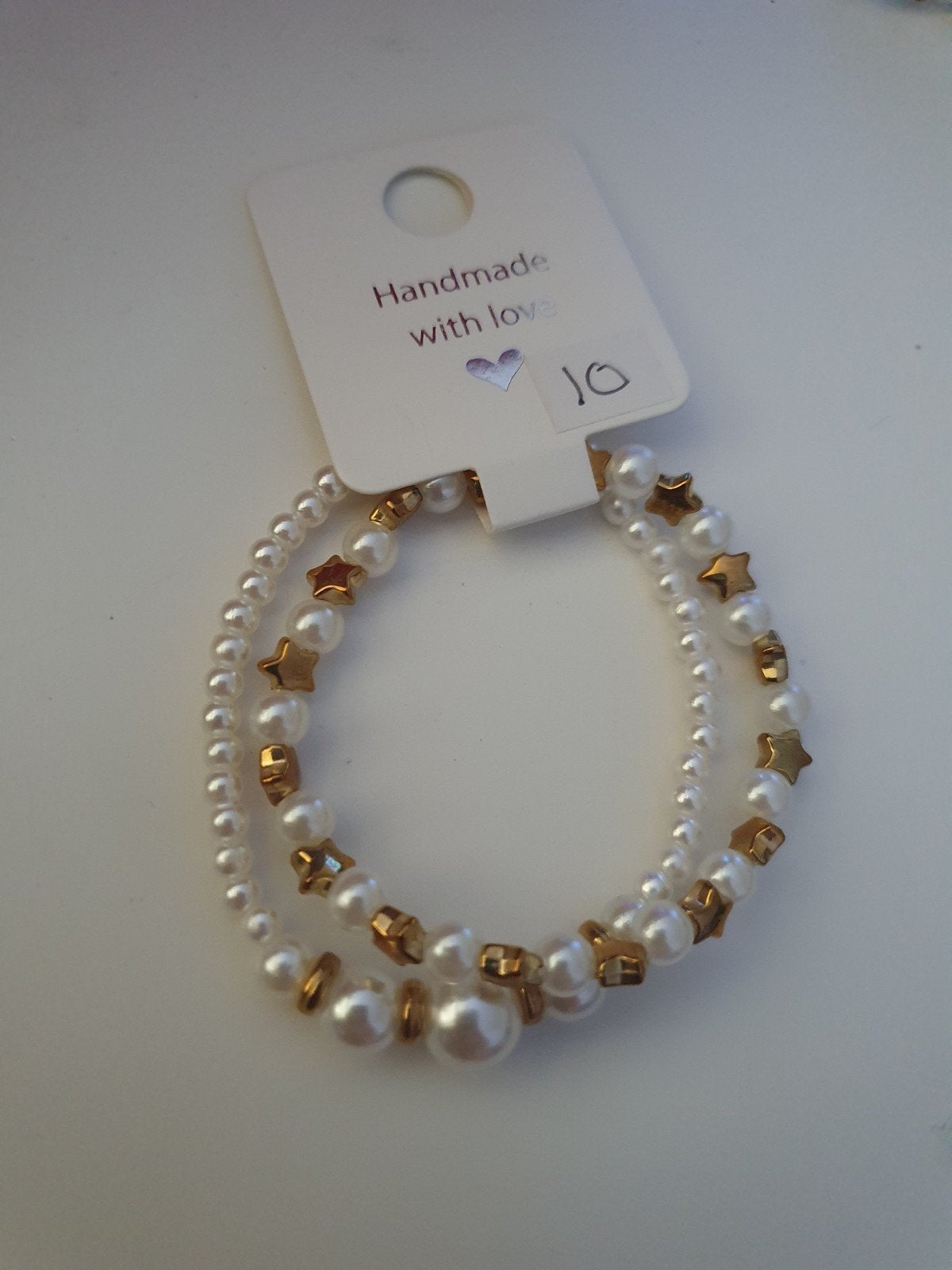 Armbandjes met kralen en sterren - opbrengst voor Kika, Overige materialen, Wit, Nieuw, Ophalen of Verzenden