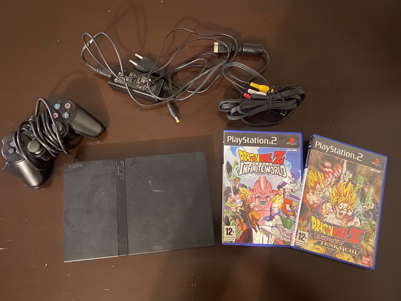 Sony Playstation 2 Slim + controller en dragonball Z games, Spelcomputers en Games, Spelcomputers | Sony PlayStation 2, Zwart