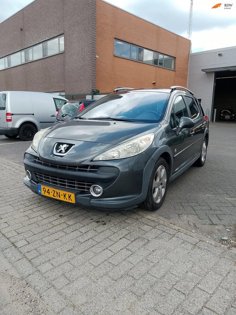 Peugeot 207 SW Outdoor 1.6 VTi XS, Auto's, Peugeot, Gebruikt, Zwart, 4 cilinders, Handgeschakeld