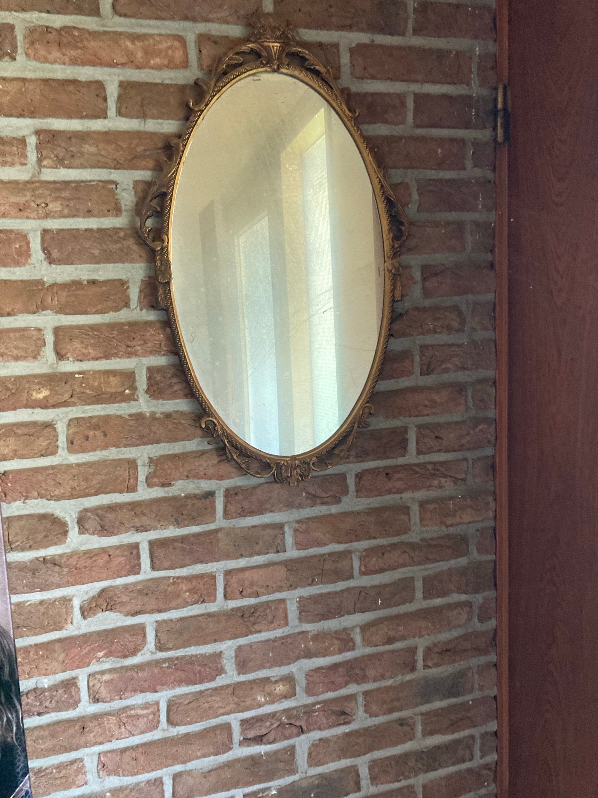 Antieke bronzen spiegel met sierlijke lijst, Ophalen