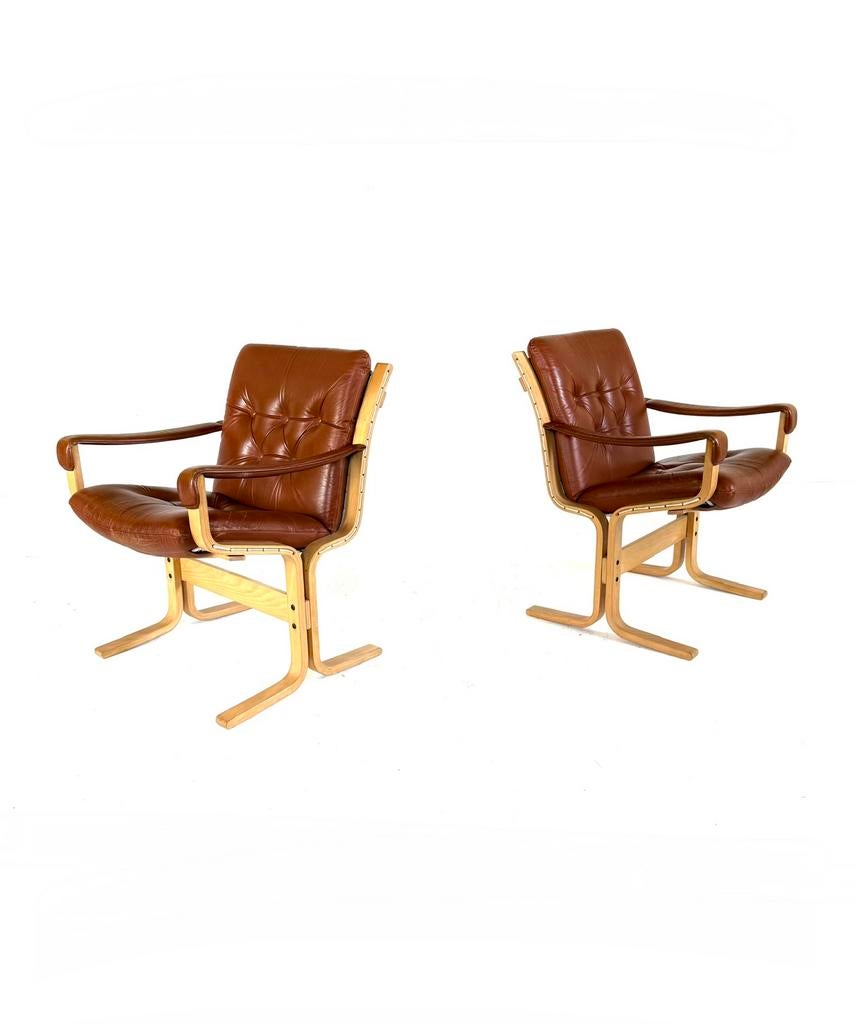 Set van 2 vintage leren ‘Siesta’ fauteuils, Westnofa ‘70, Huis en Inrichting, Vintage retro buisframe design rotan webbing papercord deens