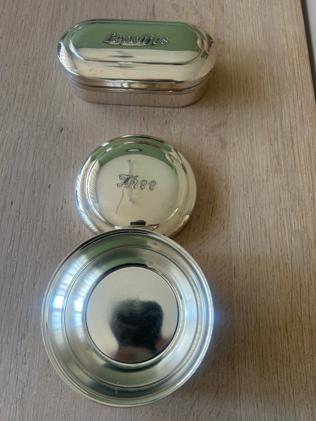Verzilverde theelepelset met doosjes, Ophalen