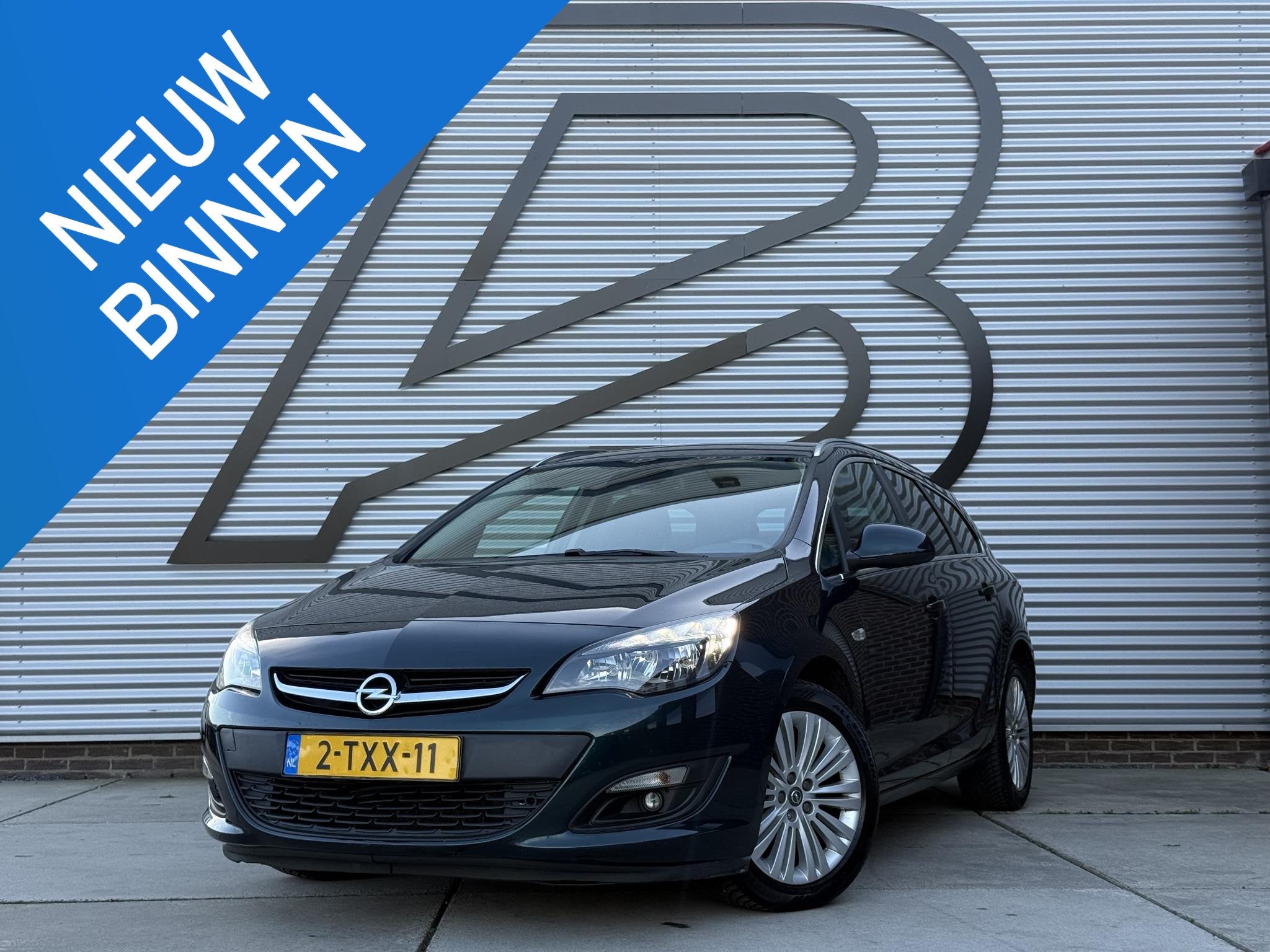 Opel Astra Sports Tourer 1.4 Turbo Design Edition Navi|Camer, Auto's, Voorwielaandrijving, Euro 5, Stof, Gebruikt