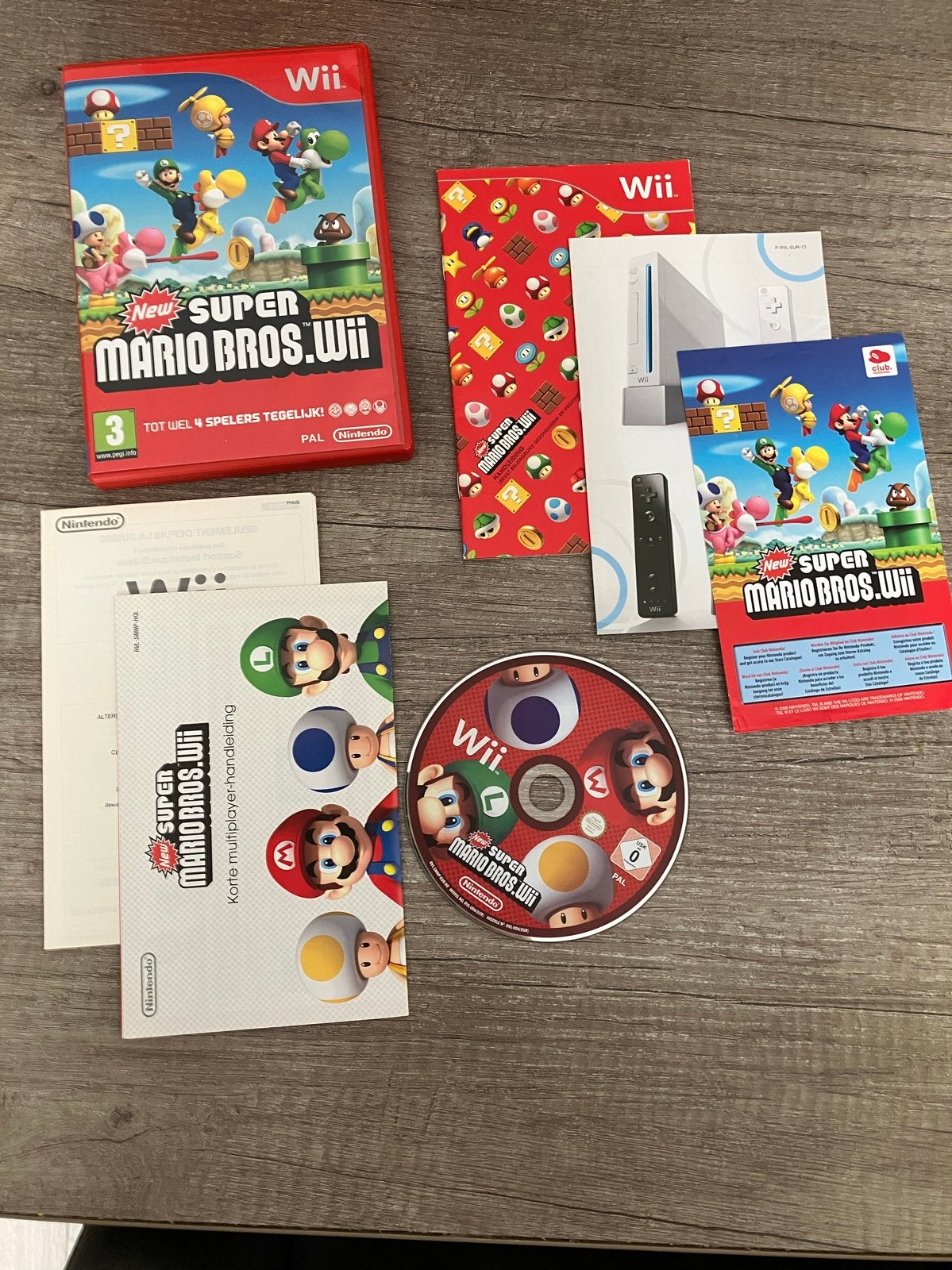 New Super Mario Bros. Wii - Compleet met handleiding, Gebruikt, Eén computer, Ophalen of Verzenden, Platform