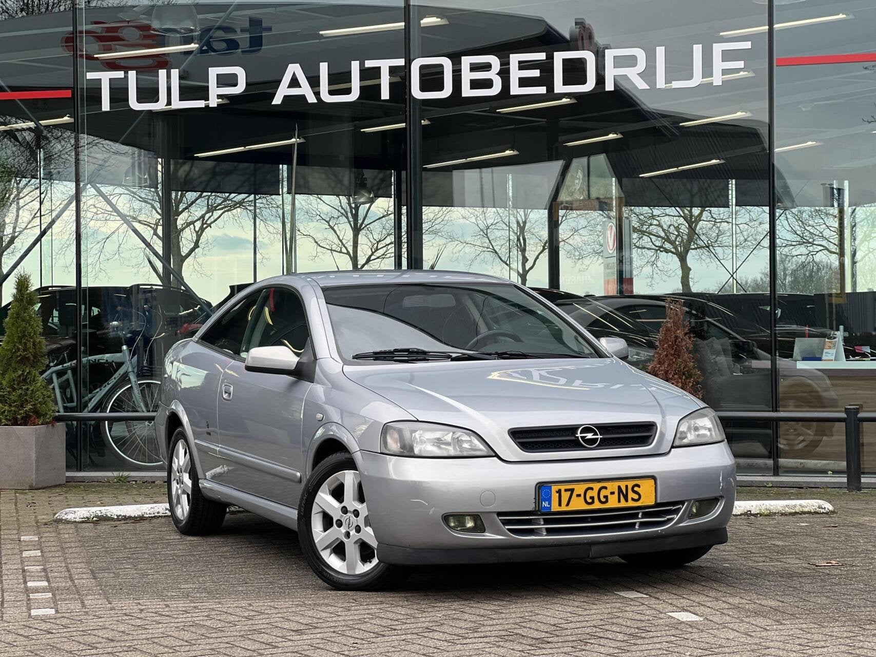 Opel Astra Coupé 1.8-16V Airco Lage km stand NAP, Auto's, Opel, 1160 kg, Stof, Zwart, 4 cilinders