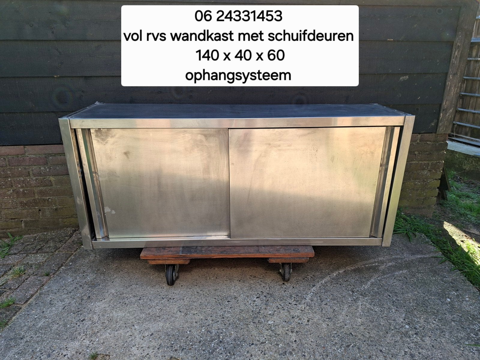 Vol rvs wandkast met schuifdeuren en ophangsysteem, Ophalen, 100 tot 150 cm, Zo goed als nieuw, Minder dan 100 cm