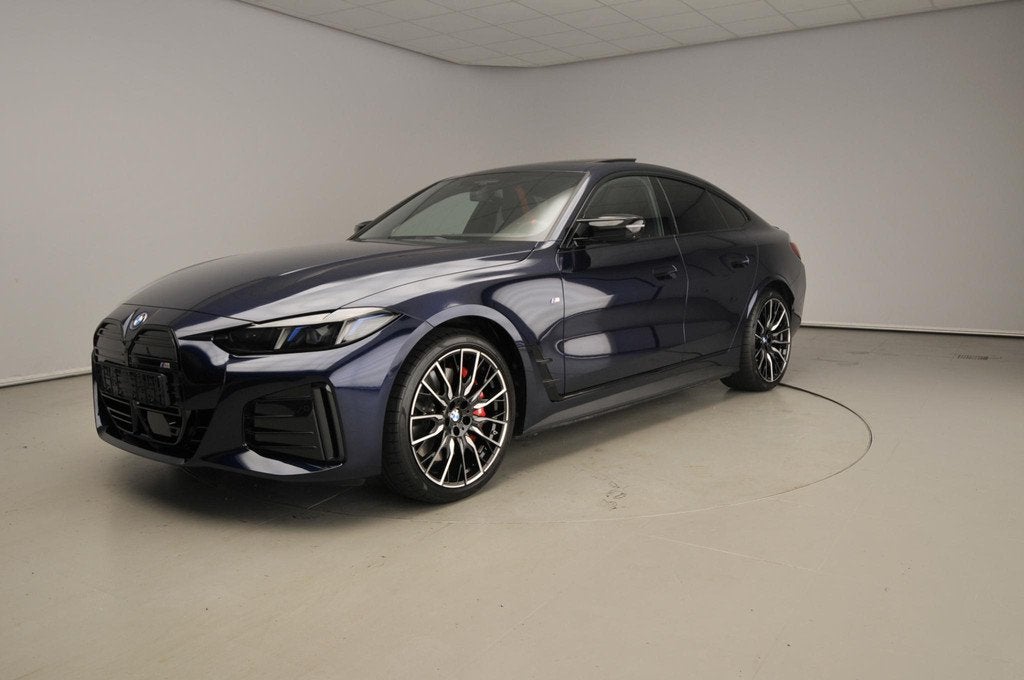 BMW i4 Grand Coupe M60 | M-Sportpakket | Leder | HUD | Activ, Auto's, BMW, Zwart, Met garantie (alle), Blauw, 601 pk