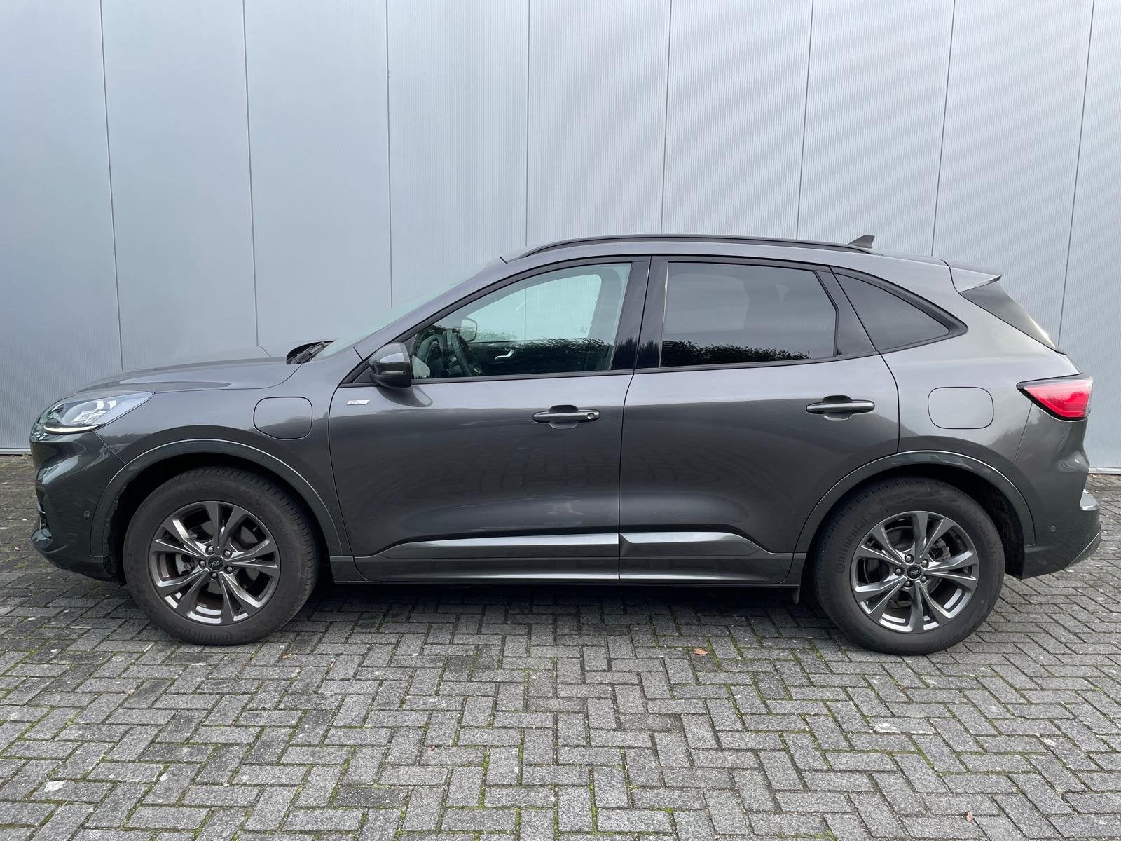 Ford Kuga 2.5 PHEV ST-Line X | Elek. Trekhaak | Winterpack |, Auto's, Dealer onderhouden, Gebruikt, 4 cilinders, Leder en Stof