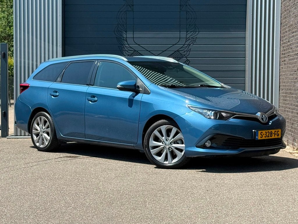 Toyota Auris Touring Sports 1.8 Hybrid Business Pro Automaat, Auto's, Toyota, Gebruikt, Euro 6, Blauw, Automatische klimaatregeling